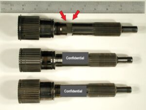 An overview of the fractured input shaft (top) and two comparison shafts that had undergone similar racing conditions.
