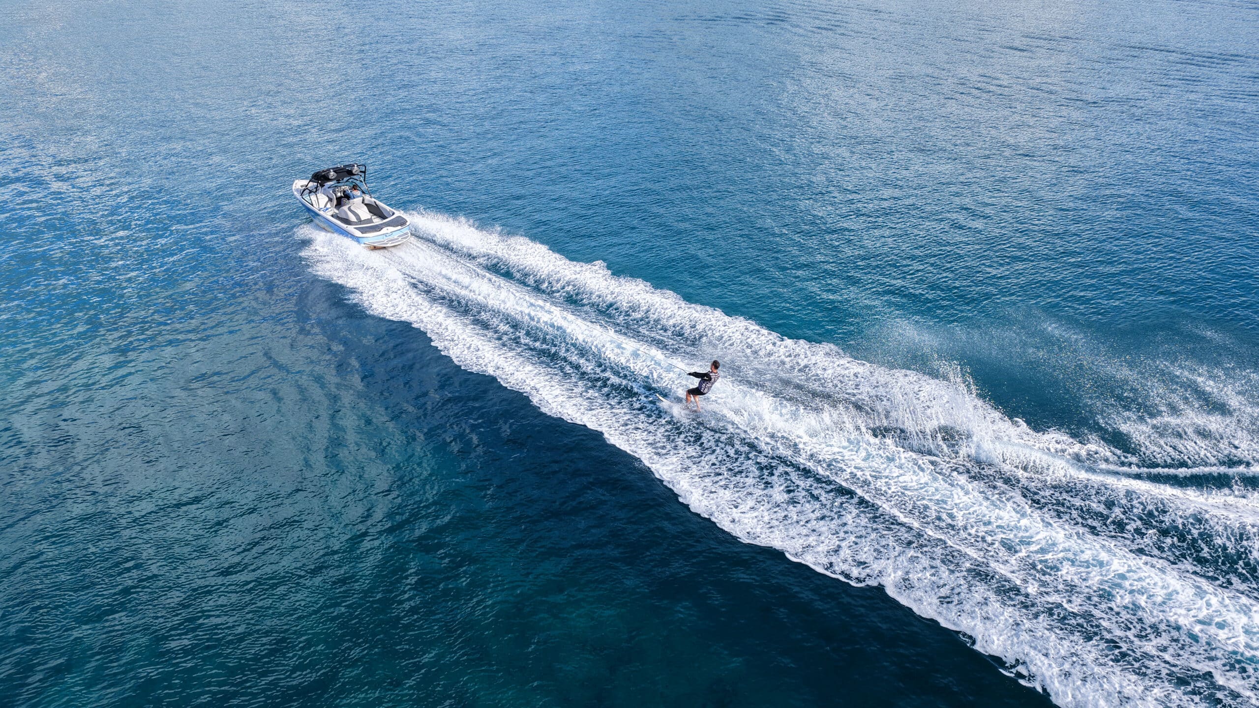 Aerial drone photo of water skier practice in open ocean sea