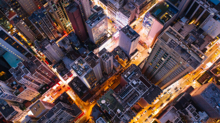 Aerial top view of downtown district buildings in night city li