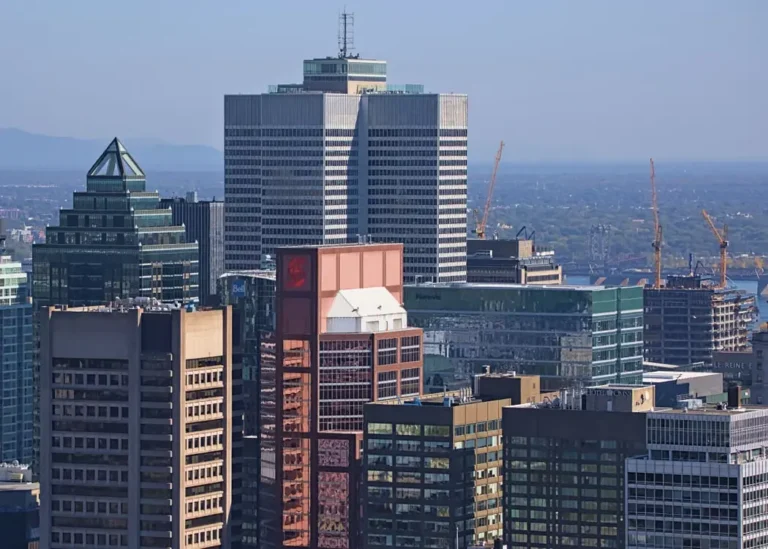 Montréal, Québec, Canada, featuring prominent office towers like the cruciform Place Ville Marie tower in the center background, as seen from Mount Royal.