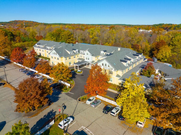 Historic residential house aerial view in fall at Concord Park in West Concord, town of Concord, Massachusetts MA, USA.